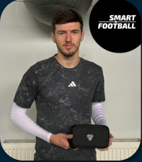 Petar Sučić holding INSAIT JOY Smart Shinguards